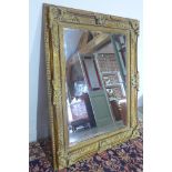 A large modern ornate gilt mirror - 1.6 m x 1.