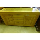 A good quality oak sideboard with an inset glass top 144cm wide - as new