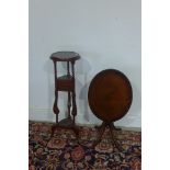 A reproduction wig stand and a small tilt top side table