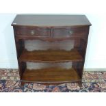 A mid 20th century mahogany bowfront open bookcase with two frieze drawers - Height 90 cm x Width