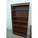 A mahogany effect fixed shelf bookcase 1.