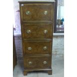 A tall walnut effect four drawer chest - Height 1.