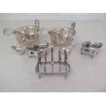 Two hallmarked silver sauce boats, two hallmarked silver ladles,