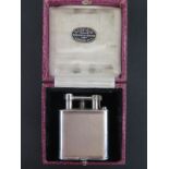 A Dunhill silver Gents pocket lighter with engine turned finish