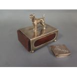 A silver desk matchbox surmounted by a dog and a sterling silver stamp box general usage 
Condition