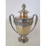 A silver hallmarked miniature trophy by Sebastian Henry Garrard the maker of Wimbledon and other