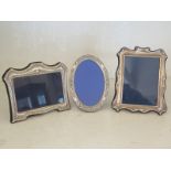 Three silver hallmarked picture/photograph frames, one with foliate and bird embossed design,