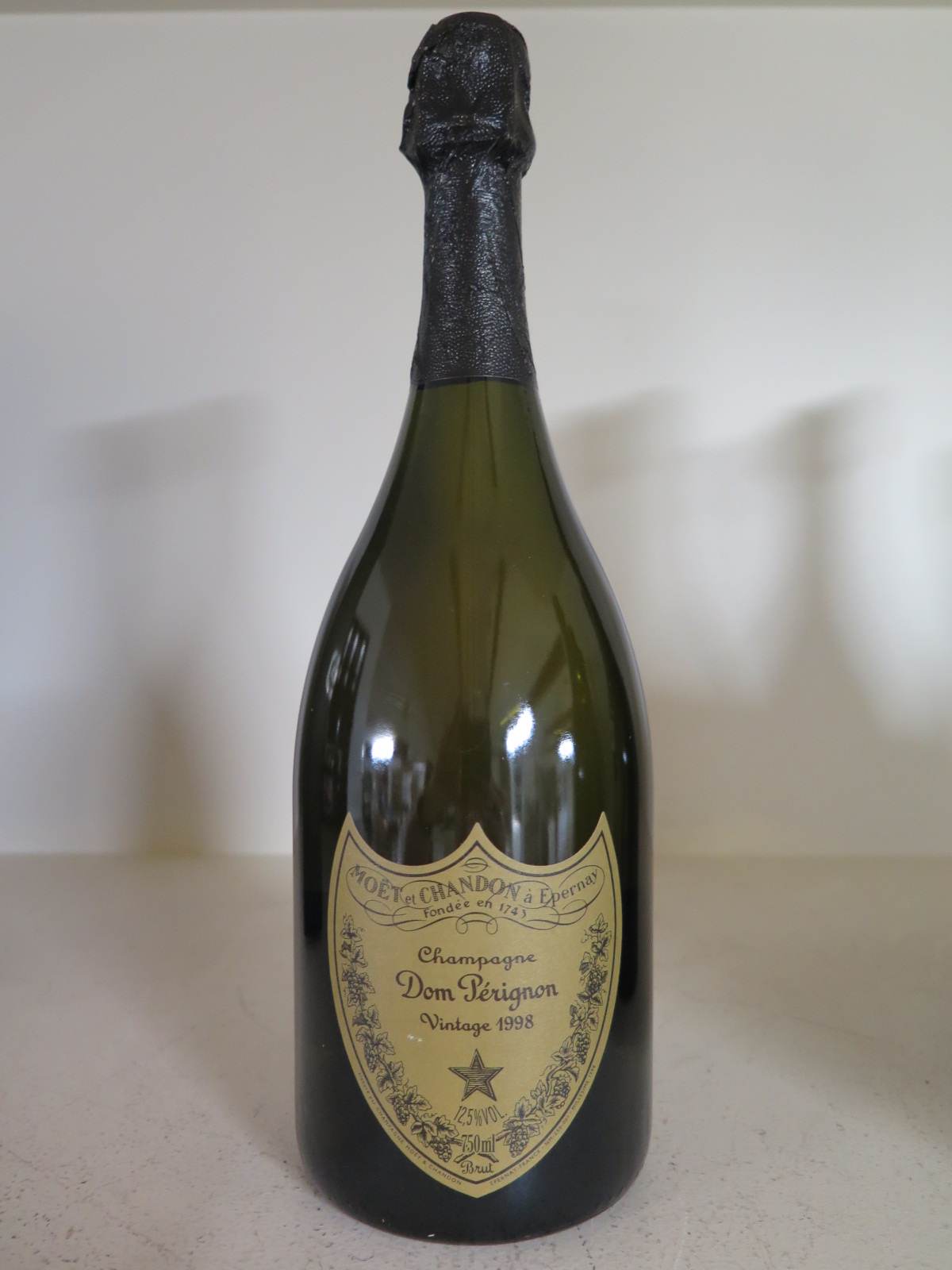 A bottle of Moet et Chandon Dom Perignon Vintage Champagne 1998 - 12.