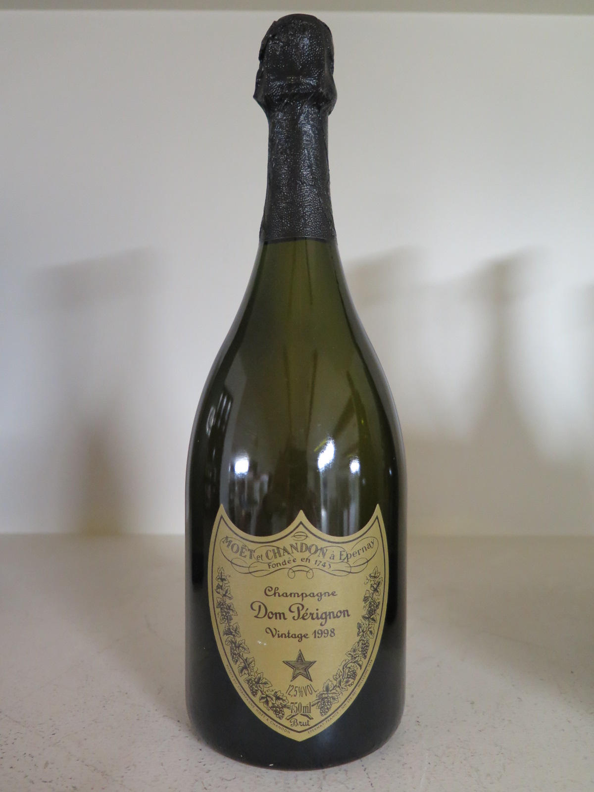 A bottle of Moet et Chandon Dom Perignon Vintage Champagne 1998 - 12.