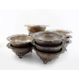 A set of nine electroplated bowls, by G.G and S, circular form, with a pierced foliate border, on