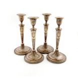 A set of four George III old Sheffield plated candlesticks,  unmarked circa 1780, tapering