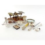 A mixed lot of silver items, various dates and makers, comprising: a tea strainer, a silver-