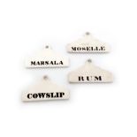 A collection of four ceramic bin labels, one stamped MINTON, tapering rectangular form, titles, '