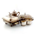 A pair of early 19th century old Sheffield plated entree dishes and covers on warming stands,