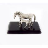 An electroplated model of a horse and foal, modelled in standing positions, on a wooden plinth,