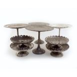 A set of four electroplated tazza, by Elkington & Co, 1925, with scalloped edge, on a lobed circular