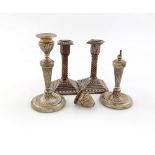 A pair of Victorian silver candlesticks, by John Batson, London 1884, swirl fluted columns, on