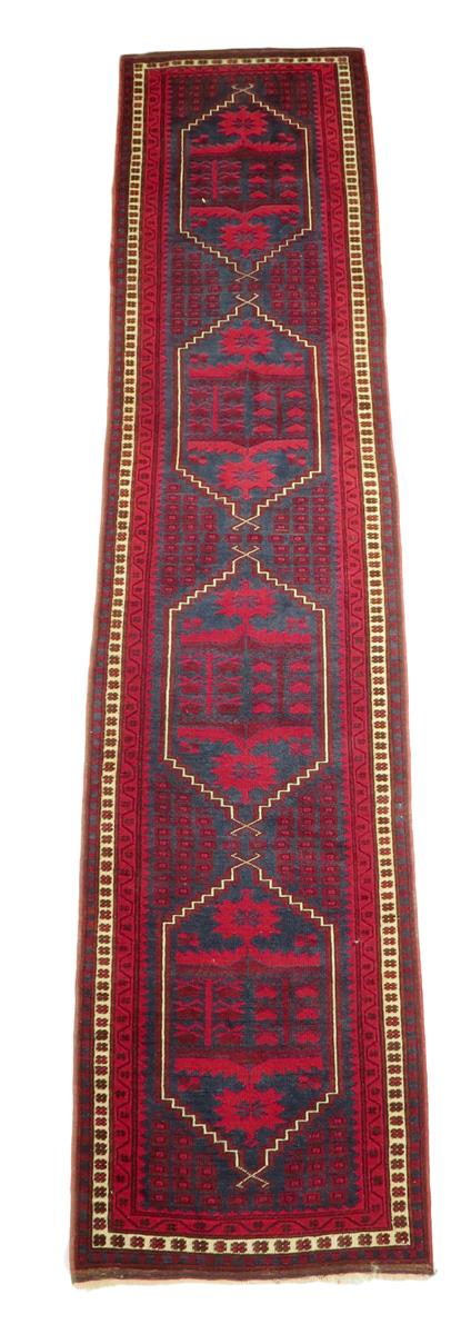 A Turkish Yagcibedir runner, West Anatolin, 20th century, 349 x 76.5cm.
 
Lot 7 – a Turkish