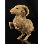 λ A late 19th century continental carved ivory model of a rearing ibex, with glass eyes, 11.2cm