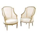 A pair of Louis XVI style bergère, each with a laurel carved frame with scroll arms with a silk