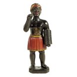A painted plaster tobacconist shop sign figure, in the form of a Blackamoor holding a roll of
