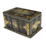 A Victorian papier-mâché tea caddy, decorated with floral sprays and gilt highlights, the interior