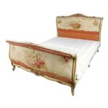 An early 20th century French painted and parcel-gilt bed, with Aubusson tapestry panels decorated