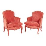 A pair of red painted fauteuil in Louis XV style, each with a leaf and moulded carved frame and