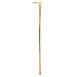 A horn riding crop by Swaine & Adeney, with an 18ct gold handle inscribed 'KENNETH ANDREWS' and 'K.