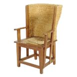 An oak and wicker Orkney child's armchair, with a drop-in seat on stretchered supports, late