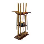 λ A croquet set, comprising: four ash handled mallets, four balls, hoops, a peg and a small