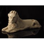 A 19th century carved marble model of recumbent lion, 21cm high, 44.5cm long.Provenance: The