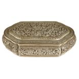 A late 19th century Indian silver trinket box, embossed with scrolling flowers and foliage, 12.8cm