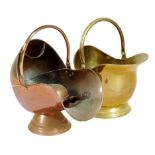 λ A copper helmet shape coal scuttle, with a rosewood handled scoop, 43cm high, 48.5cm wide,