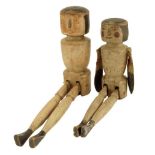 Two French carved and painted wood Folk Art doll figures, each with articulated legs, one with