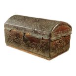 A 17th century Spanish or Portuguese leather trunk, embossed with scrolling foliage, the vacant