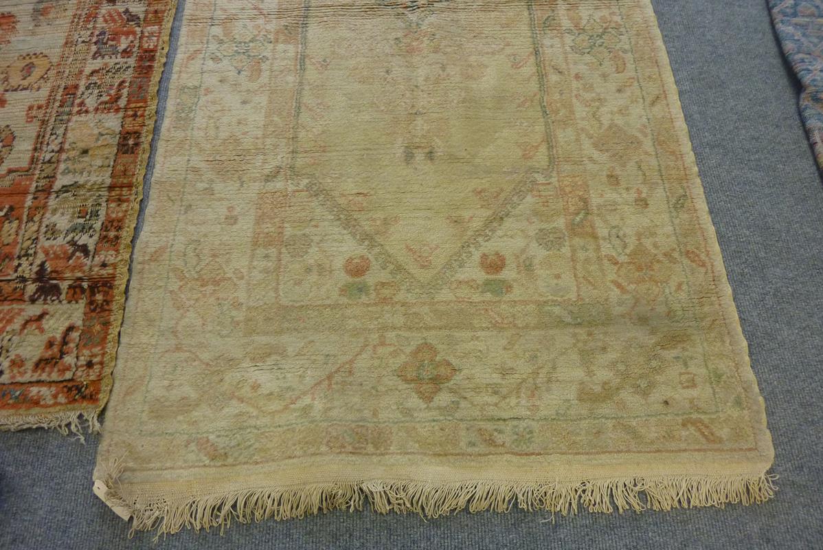 Two Turkish rugs, one with an all over floral field, the other with an elongated central - Image 3 of 6