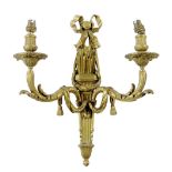 A set of four Napoleon III ormolu wall lights by Victor Paillard, each with a ribbon tied quiver