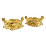 A pair of 19th century French ormolu vase mounts, decorated with leaf and 'C' scrolls. 5.8cm high,