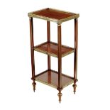 A French mahogany and brass mounted three tier étagère in Louis XVI style, with parquetry trellis