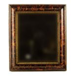 λ A pair of continental tortoiseshell and giltwood mirrors, with later plates, ripple mouldings