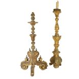 Two Italian giltwood altar candlesticks, one on scroll tripod supports, both later fitted for