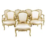 Eight Louis XV giltwood fauteuil, each with a moulded cartouche shape back with a floral leaf