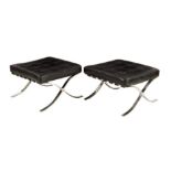 A pair of Barcelona chrome and black leather stools, originally designed by Ludwig Mies van der