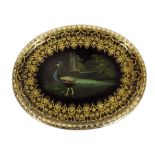 A Victorian papier-mâché tray, the centre painted with a peacock with gilt outer decoration, 63.3