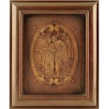 A late 19th century continental carved walnut plaque, depicting an amorous couple in front of