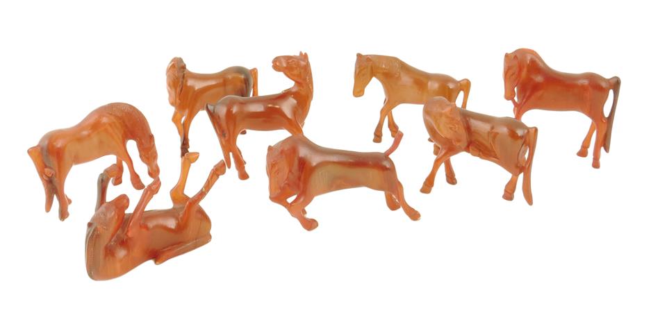 A set of eight Chinese horses of Wu Mang, possibly carved of stained horn, 20th century, 5.6cm high,