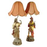 A pair of late Victorian gold painted spelter figural table lamps, in the form of a Moor playing a