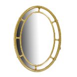 A late 19th century giltwood and composition oval wall mirror in Adam Style, with marginal plates