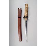 A Japanese tanto, the 32cm long blade, unsigned, with a bound sharkskin handle, cast iron tsuba,